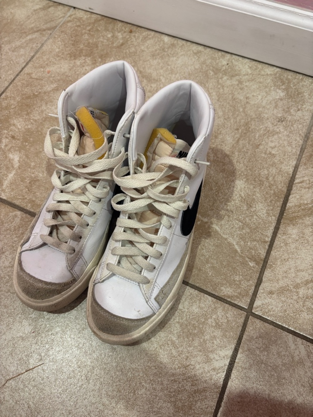 Nike Women’s White High-Top Sneakers with Black Swoosh and Yellow Tongue Accent